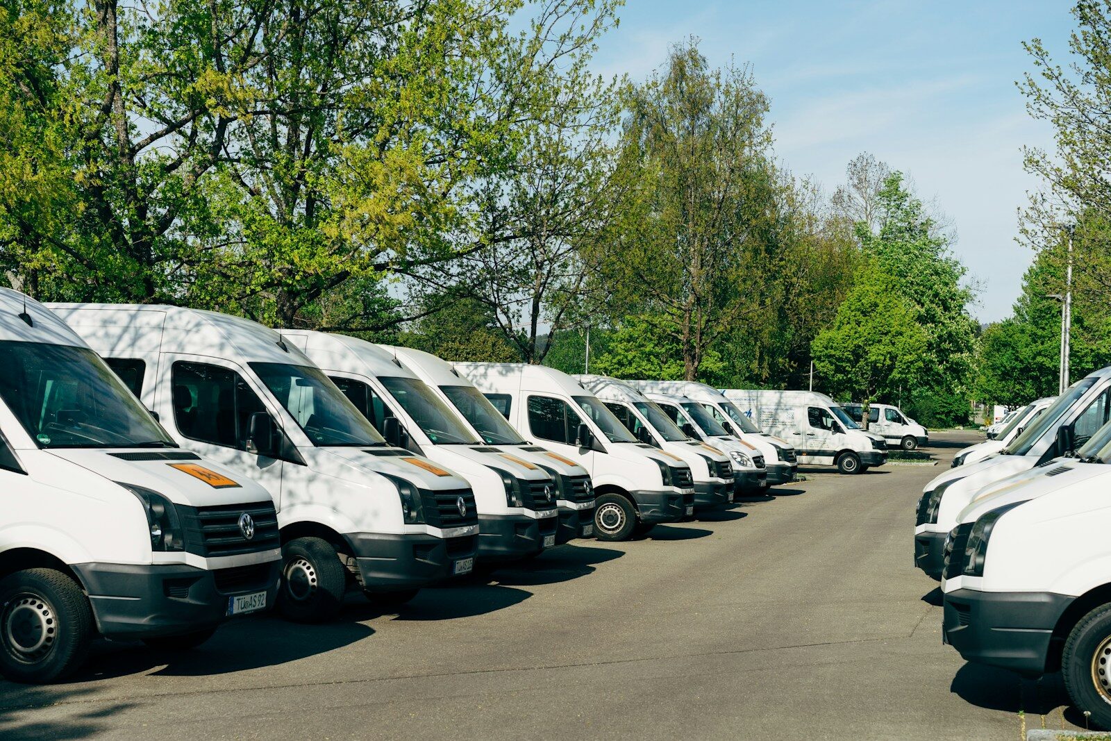 A row of white vans parked in a lot in Mössingen, Germany